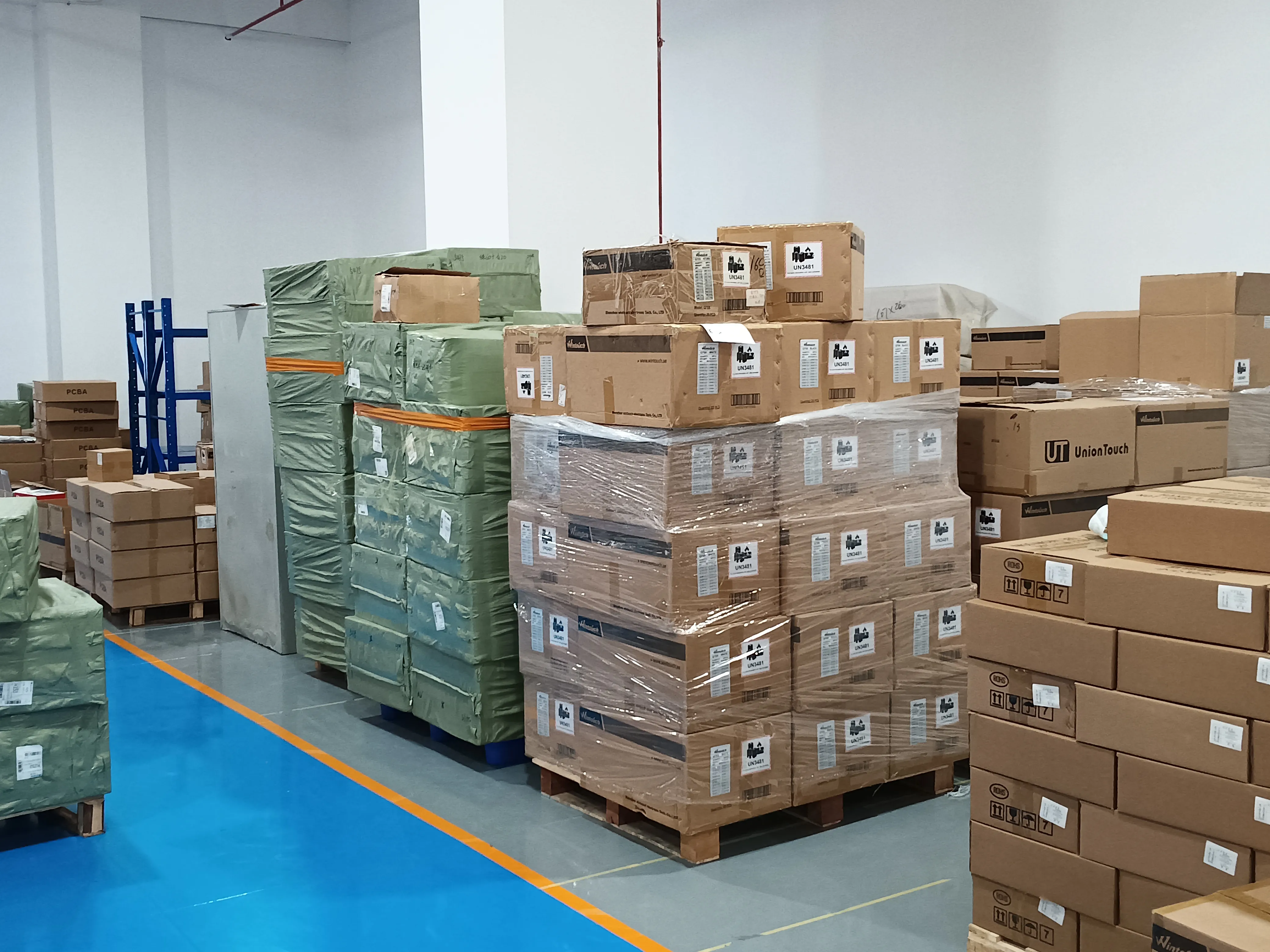 Production line workers assembling Android tablets at Wintouch factory